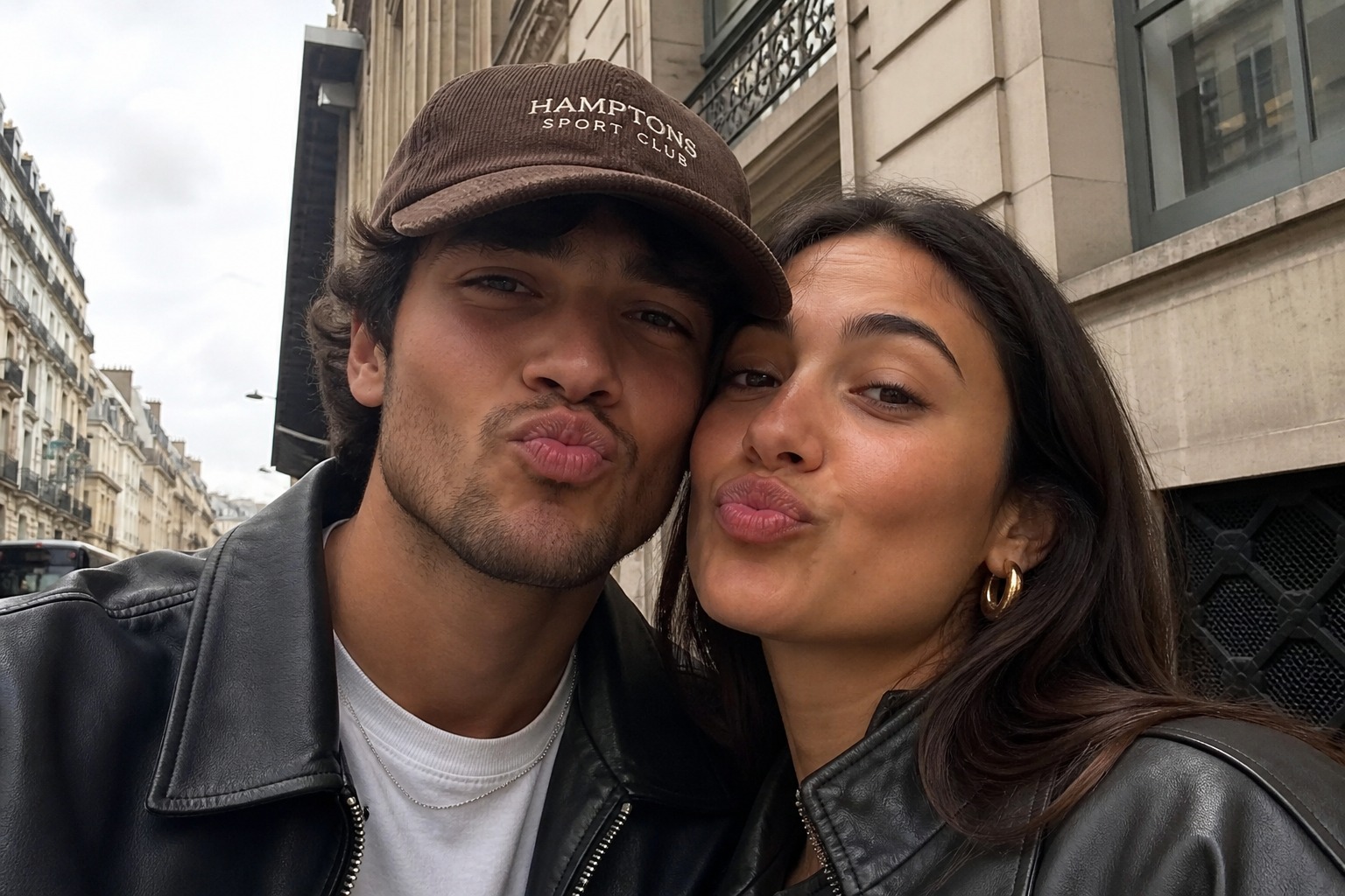 A young couple taking a selfie on a Paris street