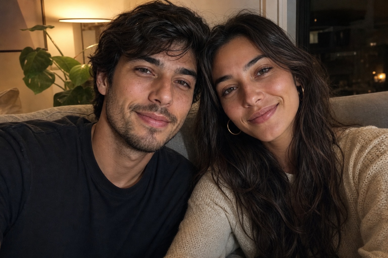 The couple at home on the sofa in the evening