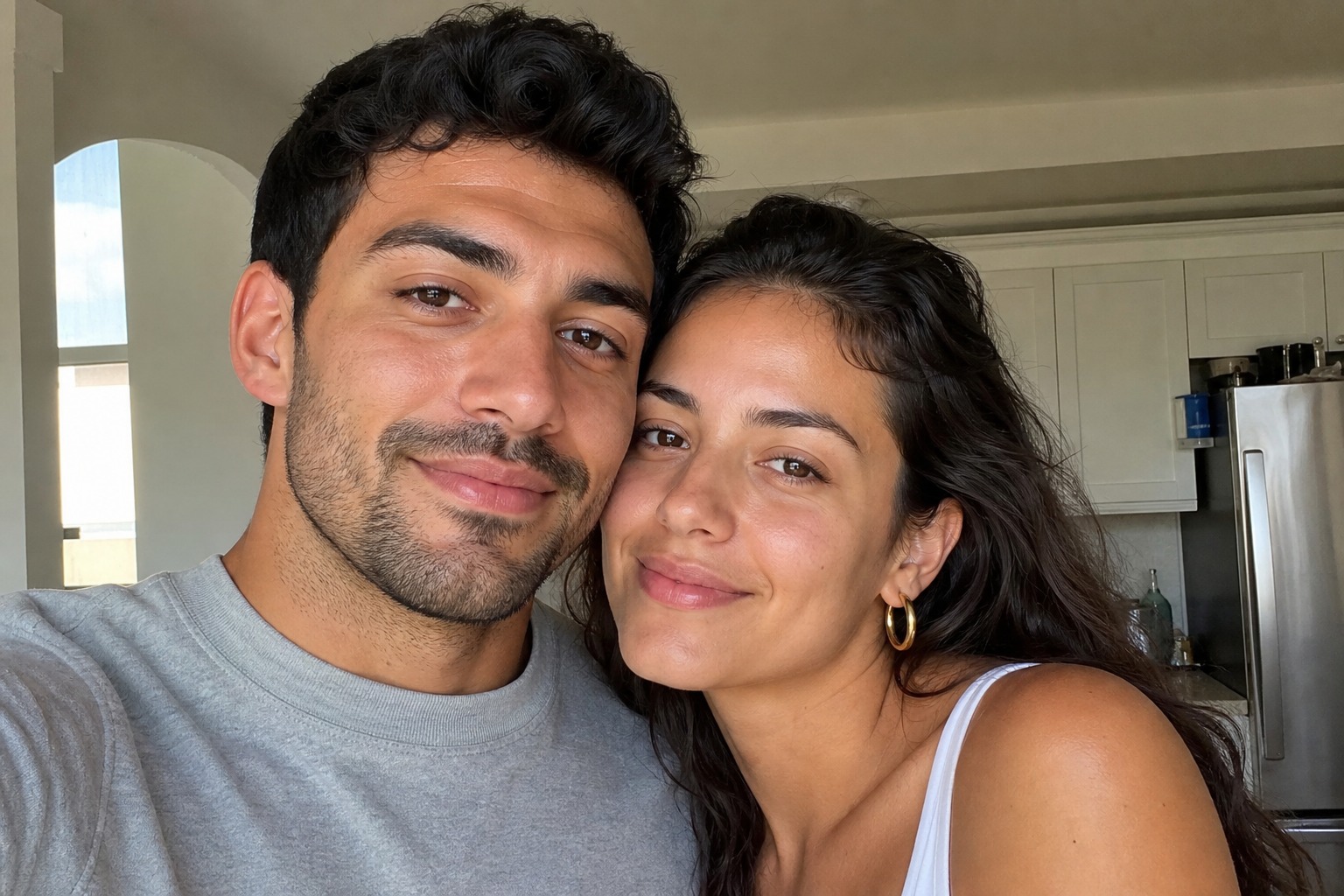 The couple in their kitchen in daylight